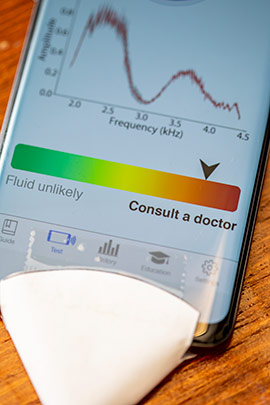 detail shot of smartphone app to detect middle ear fluid