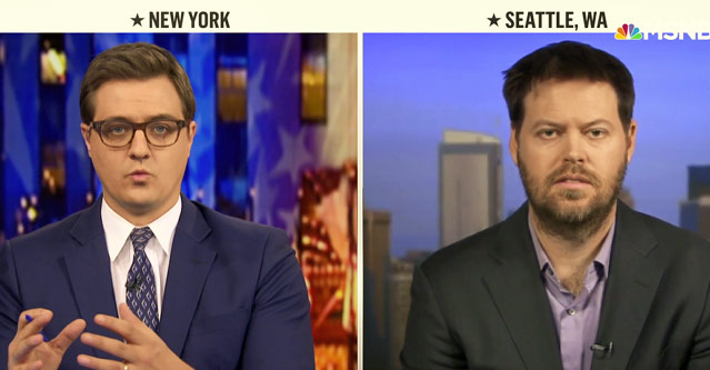 Dr. Alex Greninger, right, is interviewed March 10.