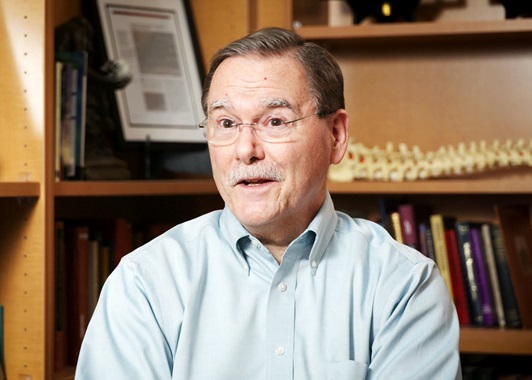 A man in a blue shirt in an office