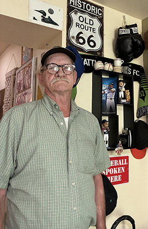 picture of Randy Critz in his apartment with memorabilia