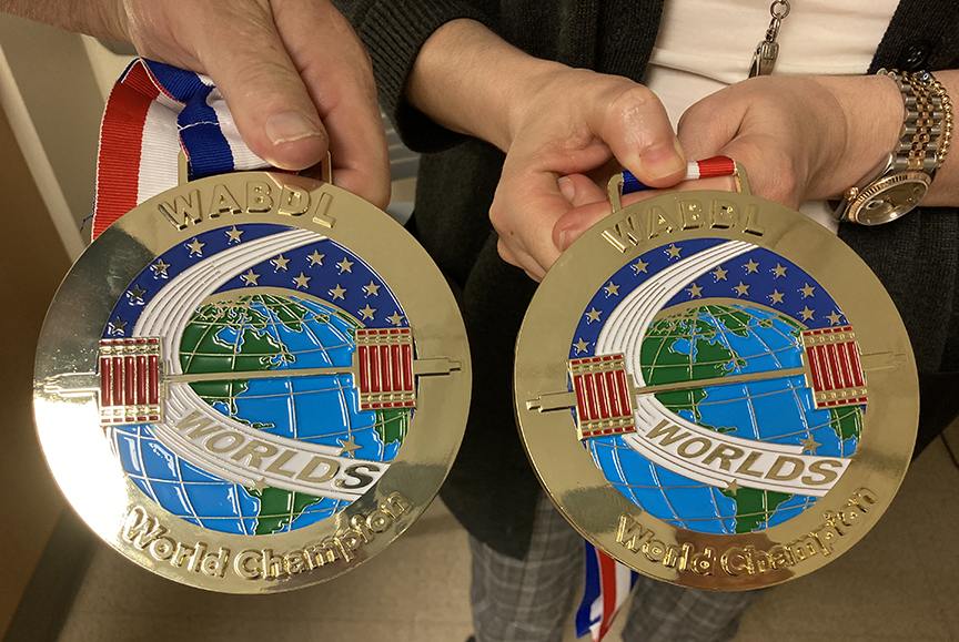 picture of two gold medals for a weightlifting contest