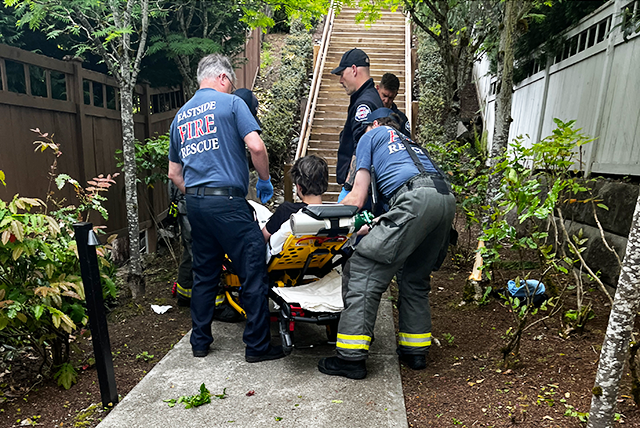 picture of first responders attending to Yann Gorbatov at the scene of his bike accident