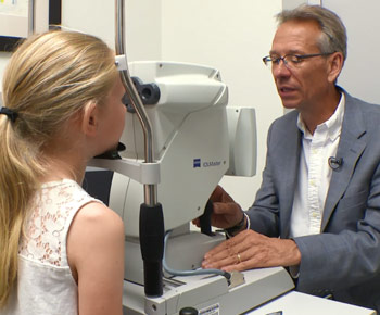 Jay Neitz examines Kayla Radovich'