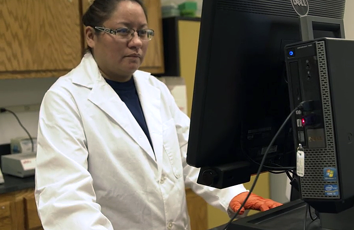 picture of lab tech at Native BioData Consortium