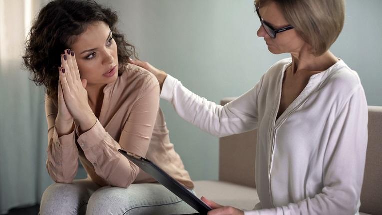 doctor counseling young woman
