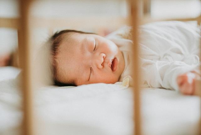 Baby sleeping in a crib
