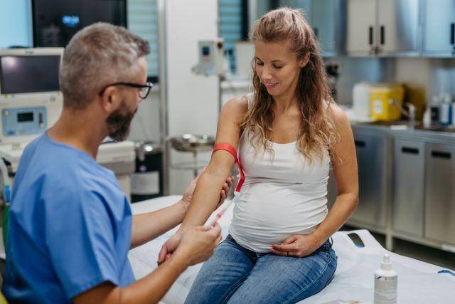 Pregnant woman getting a blood draw