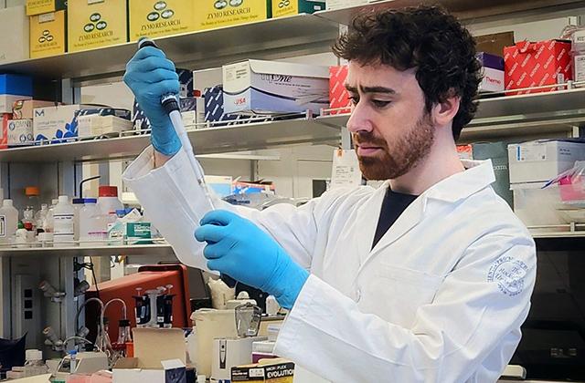 Andrew Luskin in a lab at Rockefeller University where he is now a postdoc