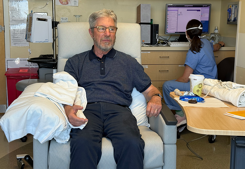 picture of patient David Park upon completing an infusion of donanemab at Harborview Medical Center 