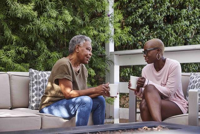 Two Black women talking