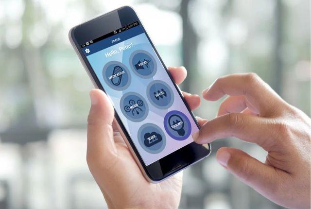 Image of a person using the FOCUS app on their smart phone.