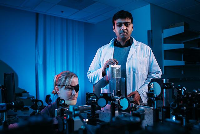 Ophthalmology researcher Ram Sabesan conducts a vision exam using optoretinography. 