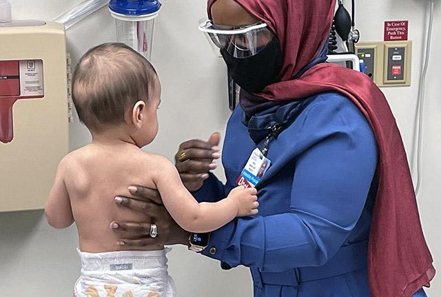 Media Name: anisa_ibrahim_with_baby_patient_smaller_cropped.jpg